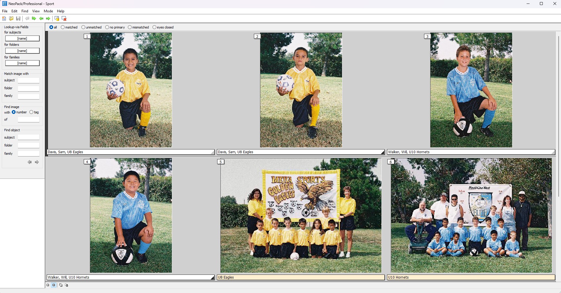 Youth soccer players posing with their team banner and soccer balls in a park.