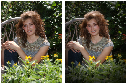 A young woman smiles while sitting among vibrant flowers in a garden setting.