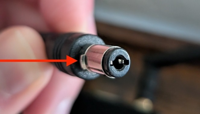 E300 power plug with an arrow showing the metal barrel that should not be visible once the plug is fully inserted
