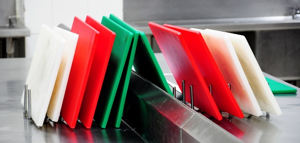 A close-up of several cutting boards Description automatically generated