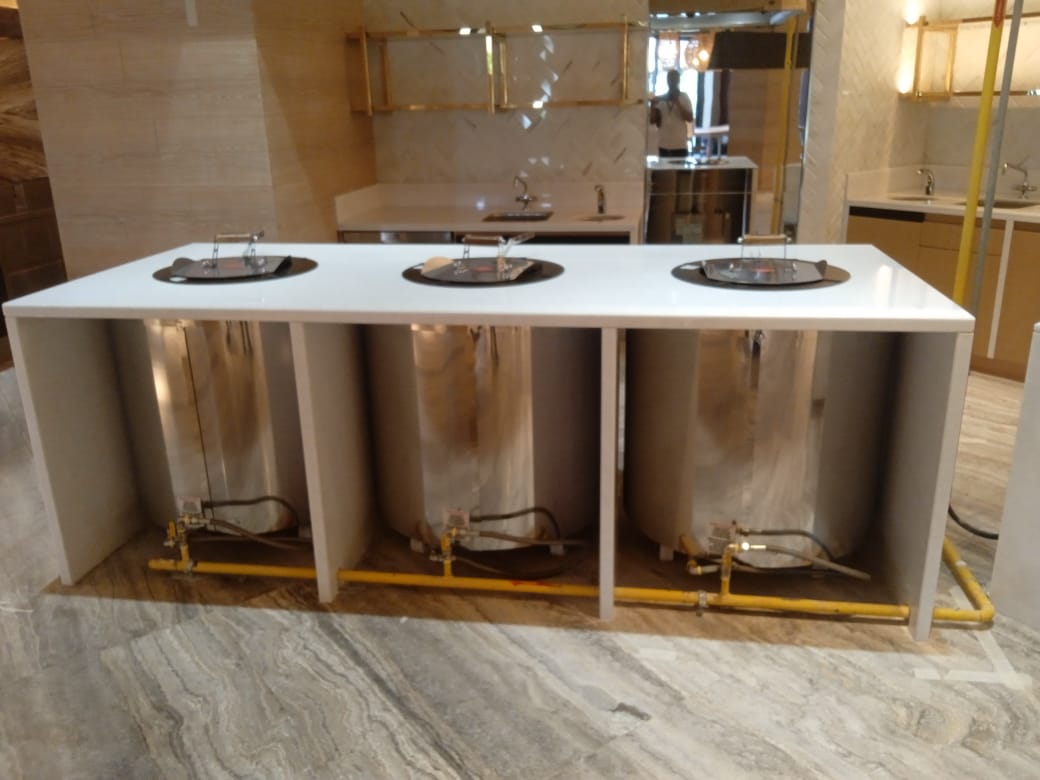 A row of silver tanks Description automatically generated