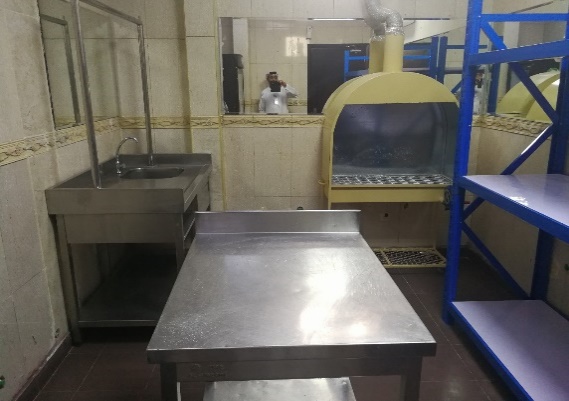 A kitchen with a large table and a large oven AI-generated content may be incorrect.