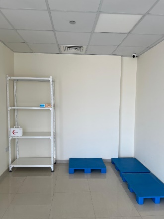 A room with blue pallets and a white shelf AI-generated content may be incorrect.