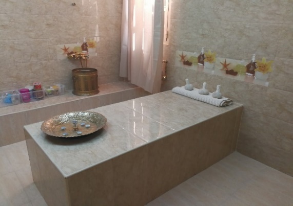 A bathroom with a large stone bench AI-generated content may be incorrect.