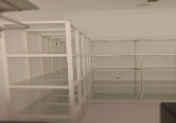 A room with white shelves AI-generated content may be incorrect.