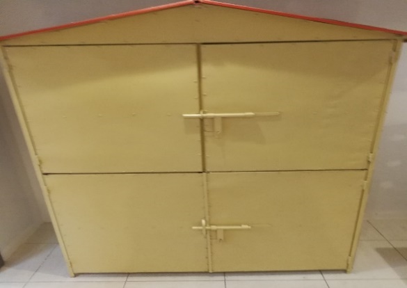 A yellow metal shed with a red roof AI-generated content may be incorrect.