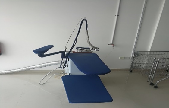 A blue medical table in a room AI-generated content may be incorrect.