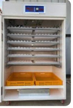 A white cabinet with shelves and yellow bins Description automatically generated